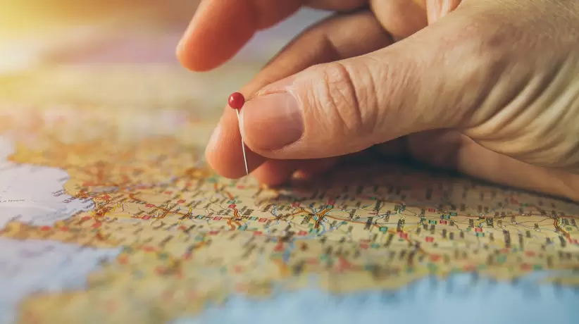 canva-hand-pinning-country-in-a-map